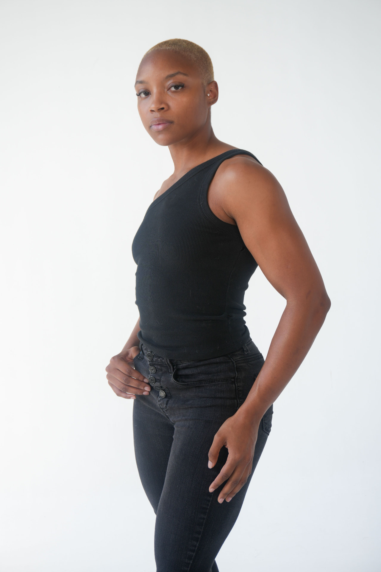 Waist-up digital facing the camera on a white studio backdrop